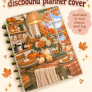 May include: A discbound planner cover featuring an illustration of a kitchen scene with pumpkins, a pie, and autumn foliage visible through a window. The text reads discbound planner cover and available in mini classic and big.