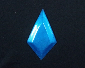 May include: A bright blue diamond-shaped decorative piece with a glossy finish.