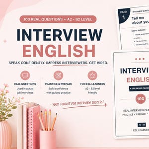 May include: A set of Interview English speaking cards for A2-B2 level learners, featuring 100 real interview questions. The cards are white with dark blue and pink text. A pink pencil holder with pencils and a pink vase with flowers are also visible.
