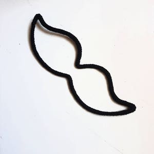 Moustache en tricotin