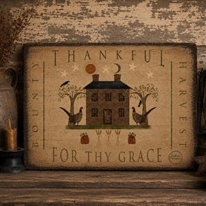 May include: A rectangular wooden sign with a distressed finish featuring a brown house, two pheasants, trees, and the text "THANKFUL BOUNTY" and "FOR THY GRACE" printed in black. The design includes a sun, moon, stars, and wheat stalks.