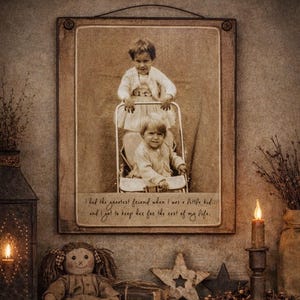 May include: A framed sepia-toned photograph of two children in a stroller. The frame is wooden and has a wire for hanging. The text on the photo reads, "I had the greatest friend when I was a little kid... and I got to keep her for the rest of my life."