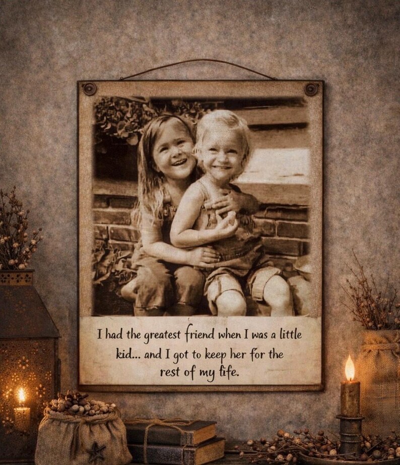 May include: Sepia-toned framed print featuring two smiling children embracing. The print includes the text: "I had the greatest friend when I was a little kid... and I got to keep her for the rest of my life."
