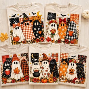 May include: Five beige t-shirts featuring various Halloween-themed ghost illustrations. The designs include ghosts wearing hats, holding pumpkins, flowers, or cauldrons, surrounded by autumn leaves, sunflowers, plaid patterns, and bats.