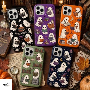 May include: Five phone cases featuring ghost illustrations and books. The black case displays the text GHOST + BOOK. The purple case shows ghosts reading. The orange case depicts ghosts with books and music. The green case shows ghosts with books and tombstones. The dark blue case features ghosts with books and stars.