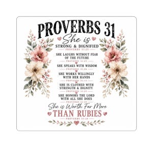 May include: A square decorative sign featuring the text Proverbs 31 and various verses in black and pink lettering. The design is framed by watercolor-style floral arrangements in shades of pink, cream, and green, accented with small pink hearts.