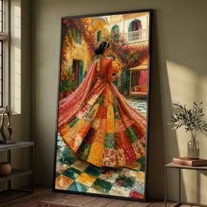 May include: A framed vertical wall art print depicting a person in a vibrant, multi-colored patchwork lehenga standing in a courtyard. The skirt features various floral and geometric patterns in shades of red, orange, yellow, and green.