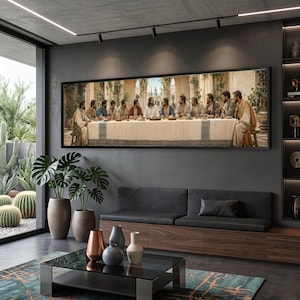 May include: A large rectangular wall art print depicting the Last Supper, featuring thirteen figures seated at a long table covered with a white cloth, set against an architectural background with stone arches and greenery in a modern living room.