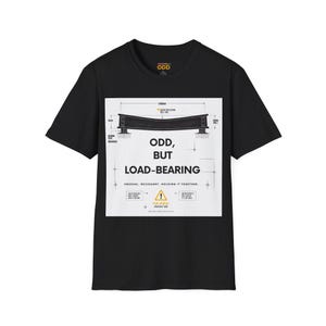 May include: A black short-sleeve t-shirt featuring a white square graphic on the chest. The graphic displays a technical engineering diagram of a load-bearing beam with the text ODD, BUT LOAD-BEARING, UNUSUAL. NECESSARY. HOLDING IT TOGETHER.