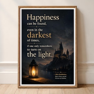 May include: A framed wall art print featuring a dark, atmospheric landscape of a castle at night with a glowing lantern in the foreground. The text reads: Happiness can be found, even in the darkest of times, if one only remembers to turn on the light.