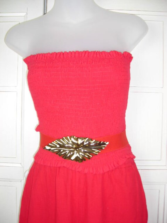 This 70's 4-piece pantsuit in bright red by DeWees