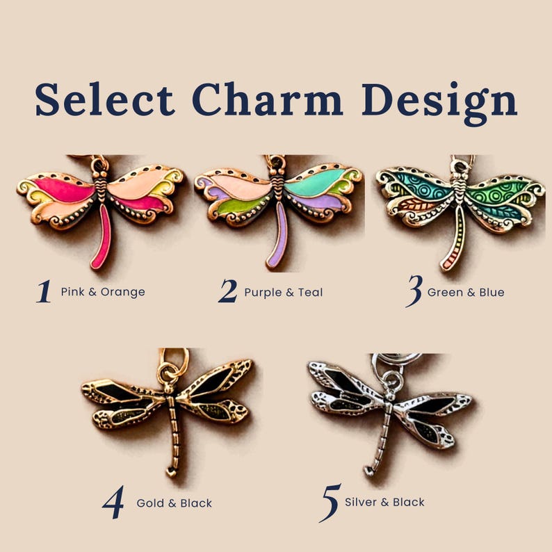 A selection of five dragonfly charms labeled Select Charm Design. 1 is pink and orange, 2 is purple and teal, 3 is green and blue, 4 is gold and black, and 5 is silver and black. Each charm features detailed wings and a body.
