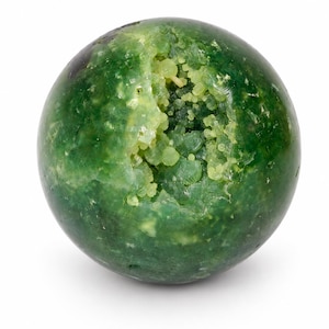 May include: A spherical green mineral specimen with a smooth, polished outer surface and a central, irregular cavity filled with small, light green crystalline clusters. The stone displays varying shades of deep forest green and lime green.