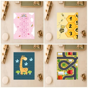 May include: A set of four rectangular area rugs featuring distinct designs: a pink hopscotch grid with clouds, a yellow honeycomb pattern with bees and numbers, a dark blue rug with a giraffe illustration, and a colorful city road map layout.