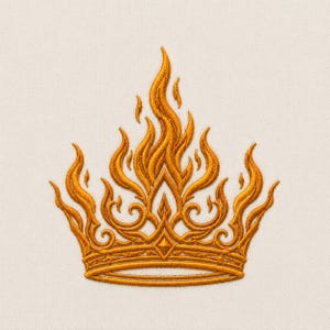 May include: An embroidered design of a crown featuring golden yellow thread. The crown is composed of intricate swirling patterns and flame-like points extending upward from a horizontal base band, creating a detailed and symmetrical motif.