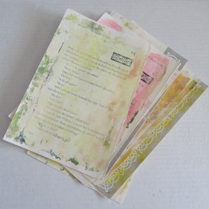 May include: A stack of aged book pages with painted accents. The pages feature text, with green, pink, and yellow watercolor-style washes. Decorative borders and the numbers 13 and 14 are visible.