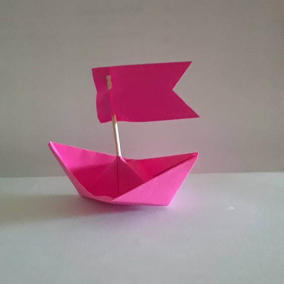 pink paper boat origami decoration sail boat beach summer holidays