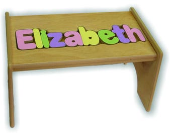 Children's Personalized Step Stool with Puzzle Piece Design.