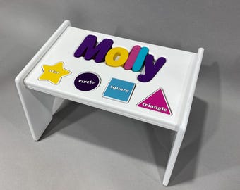 Children's Personalized Step Stool with Puzzle Piece Design.