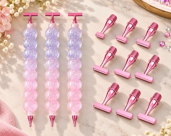 May include: Three pen bodies featuring a gradient of purple to pink glittery spherical beads with metallic pink T-shaped toppers and tips, accompanied by nine matching metallic pink pen toppers with threaded connectors for assembly.