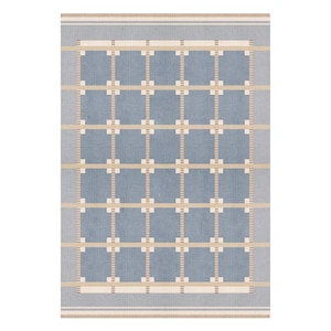 May include: A rectangular area rug featuring a grid pattern of blue squares separated by horizontal and vertical beige lines. The rug has a light gray border with thin, dark brown striped edges at the top and bottom, creating a structured design.