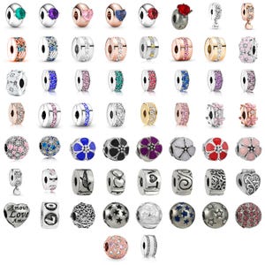 May include: A collection of various metal charm beads for bracelets, featuring diverse designs including floral patterns, heart shapes, star motifs, and embedded colorful gemstones. The beads are rendered in silver, gold, and rose gold tones with intricate textures.