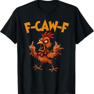 May include: A black t-shirt featuring a graphic of an angry orange chicken with its wings raised, displaying middle fingers on both hands. Above the chicken, the text F-CAW-F is printed in bold orange capital letters against the dark fabric.