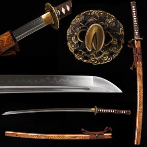 May include: A katana sword featuring a wavy hamon line on the steel blade, a brown wrapped handle, and a brass-colored circular tsuba guard with intricate dragon relief. The scabbard has a polished wood grain finish with a brown cord wrap.