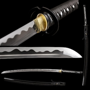 May include: A katana sword featuring a curved steel blade with a visible wavy hamon line, a gold-coloured habaki collar, a black circular tsuba guard, and a black cord-wrapped handle. The set includes a matching black scabbard with a cord attachment.