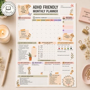 May include: A printed ADHD Friendly Monthly Planner page featuring sections for monthly overview, habit tracking, focus, self-care, brain dump, and reward planning. The design includes floral illustrations, pastel color blocks, and text prompts.