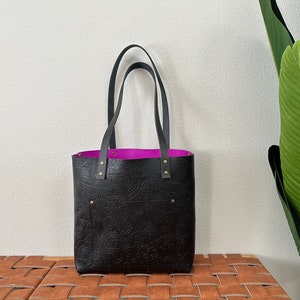 Black Floral-Embossed Leather Tote Bag with Fuchsia Leather Interior