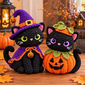 May include: Two crocheted black cats. One cat wears a purple witch hat with an orange band and a matching purple cape, both featuring small pumpkin charms. The second cat sits inside a crocheted orange pumpkin with green leaves on top.
