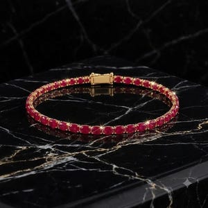 Tennisarmband med rubin i 14 karat guld | Smycken med ovala snittstenar (sterlingsilver)