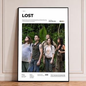 May include: A framed poster for the television show Lost, featuring a central photograph of four characters standing in a dense jungle. The text includes the title Lost, the director Jack Bender, cast names, and a brief plot summary in black.