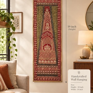 May include: A rectangular wall hanging featuring intricate red, gold, and green embroidery with floral and geometric patterns. The textile measures 19 inches in width and 59 inches in height, suspended from a wooden rod with a thin cord.