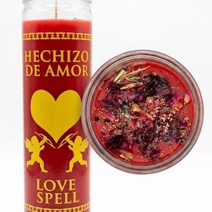 May include: A tall red glass candle featuring the text HECHIZO DE AMOR and LOVE SPELL, a yellow heart, and two yellow cherubs. The top view shows red wax topped with dried flower petals, herbs, and glitter, with a single wick centered in the wax.
