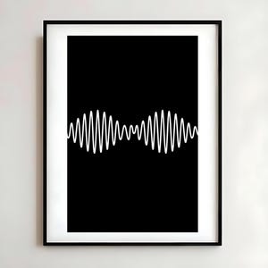 May include: A framed wall art print featuring a solid black background with a centered, horizontal white graphic line that forms two distinct, symmetrical wave patterns. The artwork is enclosed in a thin, simple black frame with a white mat border.