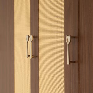 May include: A cabinet featuring dark brown wood panels alternating with light beige woven cane mesh sections. The doors are equipped with metallic, fork-shaped handles that have a distinct three-pronged top design and a vertical stem.
