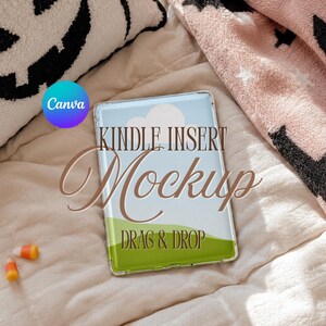 May include: A rectangular Kindle insert mockup featuring a light blue sky with white clouds and a green grassy hill. The text Kindle Insert Mockup Drag & Drop is overlaid in brown. A circular Canva logo is visible in the upper left corner.