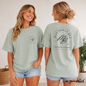 May include: A sage green short-sleeve t-shirt featuring a small logo on the front left chest and a large graphic on the back. The back design includes an arched frame with the text Magnolia Bee, the initials MB, and Mockup Studio.