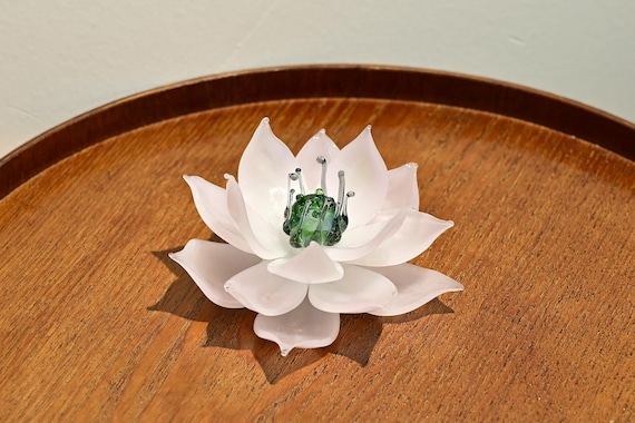 Each petal individually shaped by a glassblower's breath — a genuinely tactile, meditative sculpture that looks different from every angle.