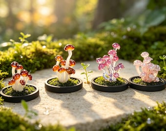 May include: Four glass mushroom sculptures arranged in a row, each set on a circular black base with green moss. The mushrooms feature varying colors including brown, pink, and white, with translucent caps and white stems, creating a detailed display.