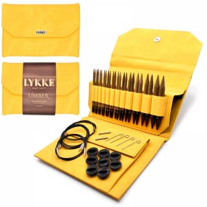 May include: A yellow Lykke Umber knitting needle set. The set includes various sizes of wooden knitting needles, black circular cables, stitch markers, and other accessories. The set is contained in a yellow fabric case with a snap closure.