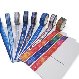 May include: A collection of decorative washi tape rolls and strips in various colors and patterns. Designs include wave patterns, patriotic motifs, and text. The tape is arranged with white paper cards, with text that reads "designed by mary hawkins in love."
