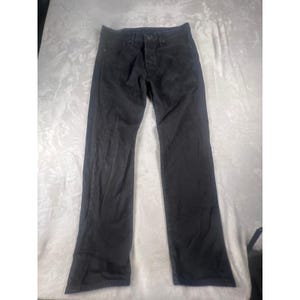 May include: A pair of solid black denim jeans featuring a classic five-pocket design, a button fly closure, and a straight-leg cut. The fabric has a subtle faded texture throughout, with visible stitching details along the seams and waistband.