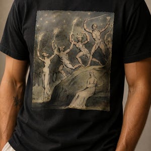 May include: A black short-sleeve t-shirt featuring a detailed graphic print of a classical illustration. The artwork depicts several mythological figures, including a minotaur and human-like forms, set against a starry night sky background.