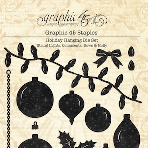 May include: Graphic 45 Staples Holiday Hanging Die Set featuring black metal cutting dies for papercrafting. Includes shapes for string lights, various round and teardrop ornaments, a bow, holly leaves, berries, and a chain on a beige background.