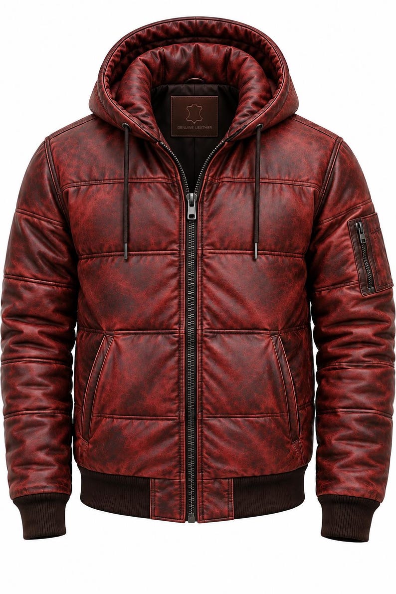May include: A deep red, distressed leather bomber jacket featuring a quilted texture, a front zipper closure, and an attached hood with drawstrings. The jacket includes ribbed cuffs and hem, two front pockets, and a small zippered pocket on the sleeve.