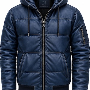 May include: A navy blue quilted leather jacket featuring a hood with drawstrings, a central metal zipper closure, two side pockets, and a zippered utility pocket on the left sleeve. The jacket has ribbed cuffs and a ribbed hem at the waist.