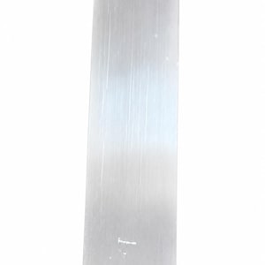 May include: A tall, slender, translucent white selenite crystal tower with a pointed, faceted top. The surface of the stone displays a fibrous, vertically striated texture with a soft, pearlescent sheen throughout its elongated, rectangular body.